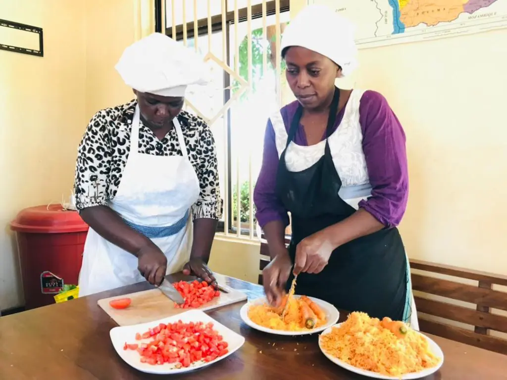 MGRC cooks preparing meals for the girls