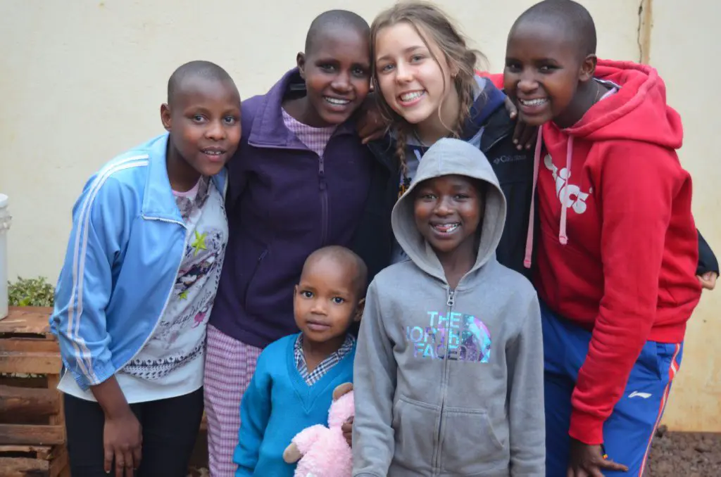 young maasai girls with their sponsor