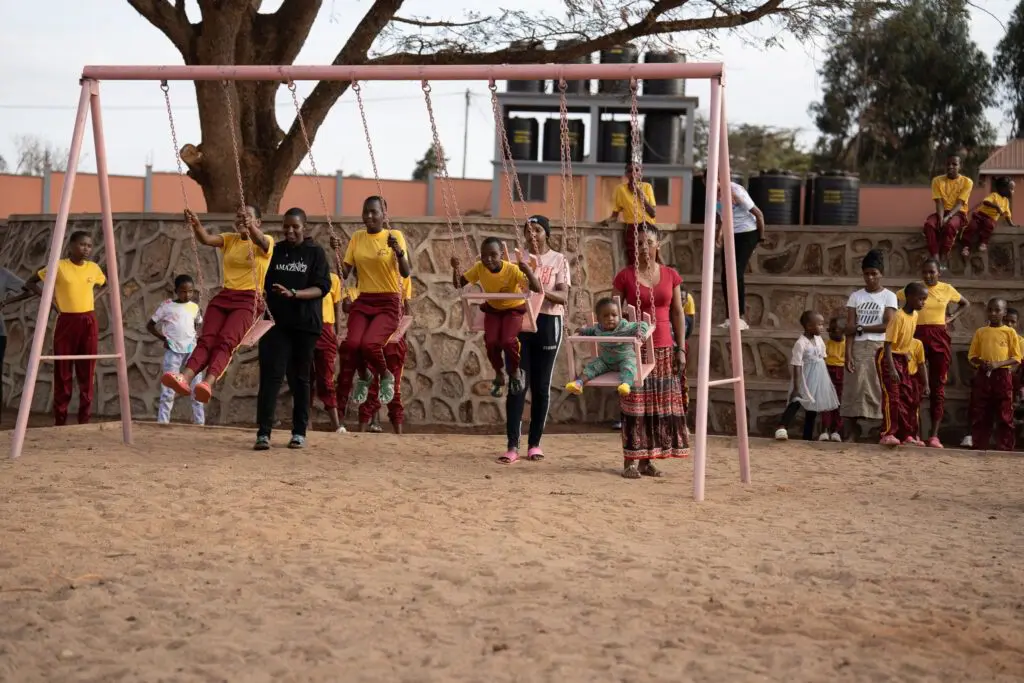 girls playing on swingset