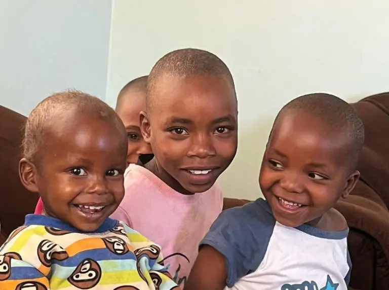 candid moment capturing maasai girls smiling and laughing