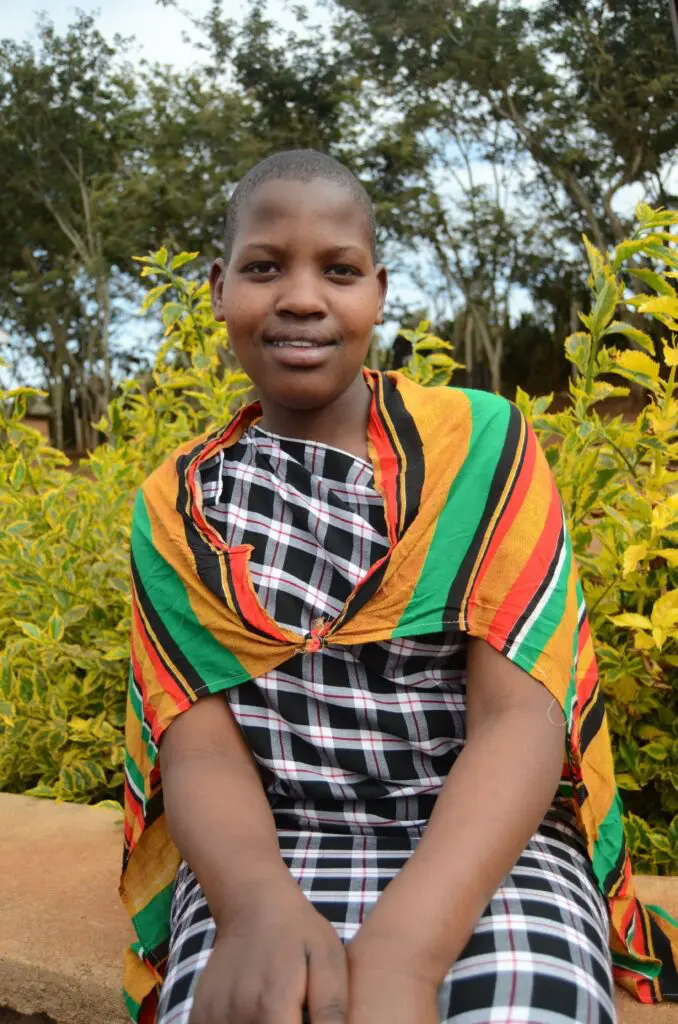 an inspiring portrait of Yeyolai sitting in front of the ecoFarm