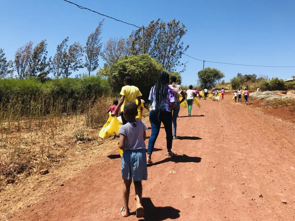 MGRC girls heading out into neighborhood to pick up litter.