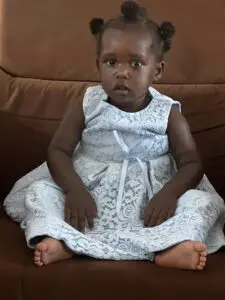 Young maasai girl sitting on the couch and will begin her preschool education journey.