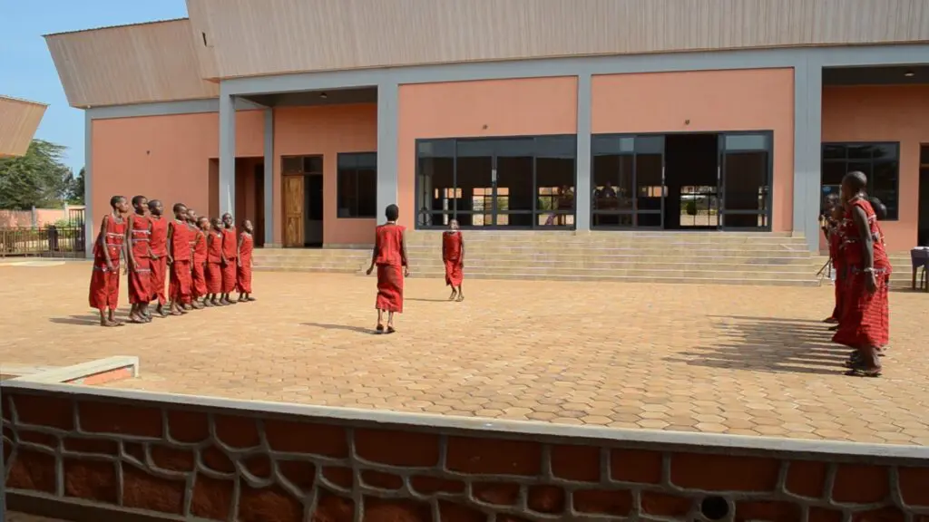 The girls performing traditional Maasai song and dance for visitors. 