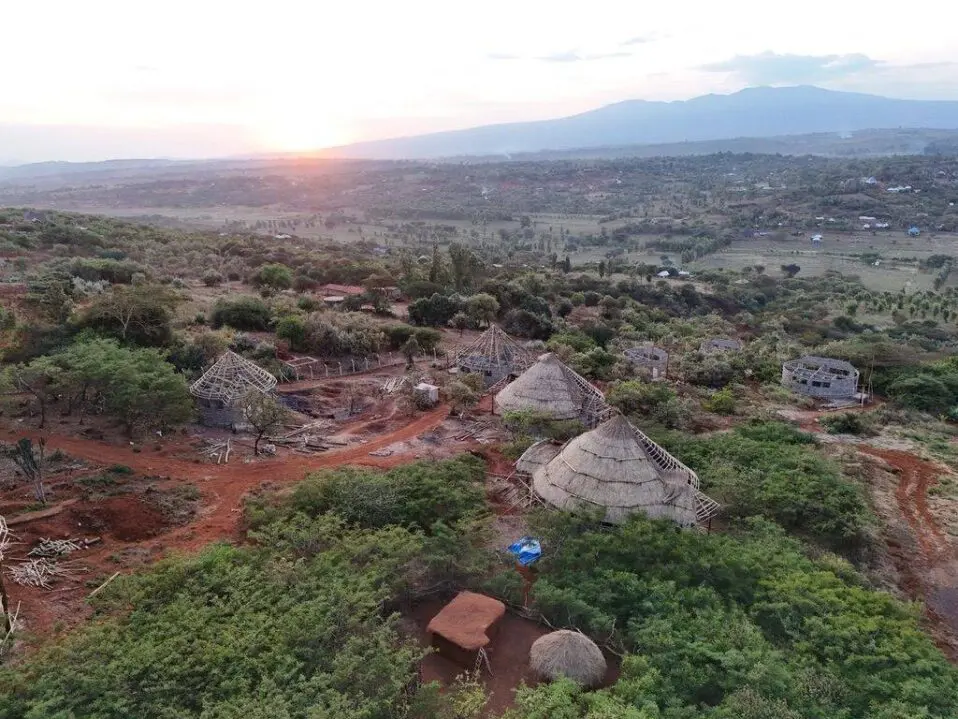 MGRC ecolodge and villas with the sun setting over the valley