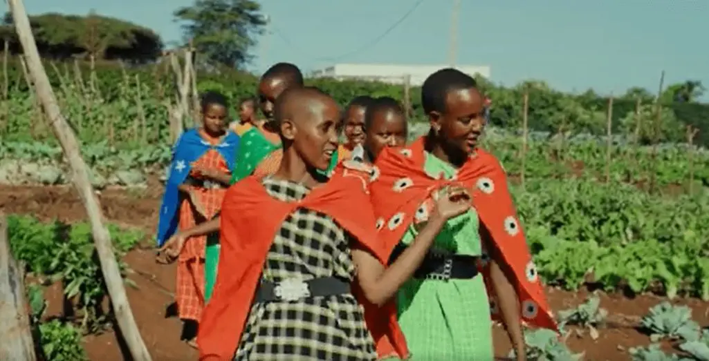 International Women's Day film featuring Momoi-walking-with-maasai-girls-in-ecofarm