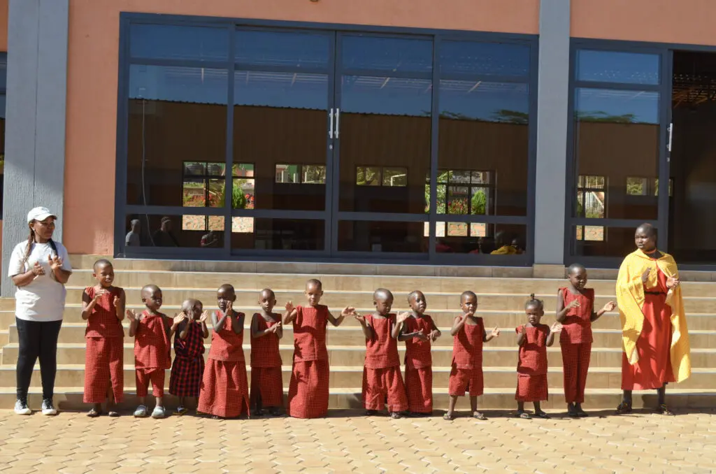 a transformative experience featuring young maasai girls singing to guests.