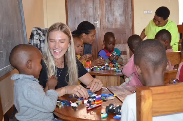 Children playing with colorful Legos.