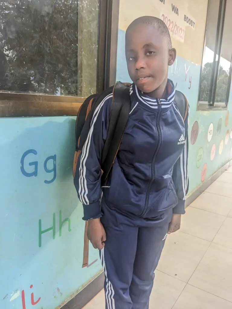 Young visually impaired girl getting ready for her trip to Goalball.