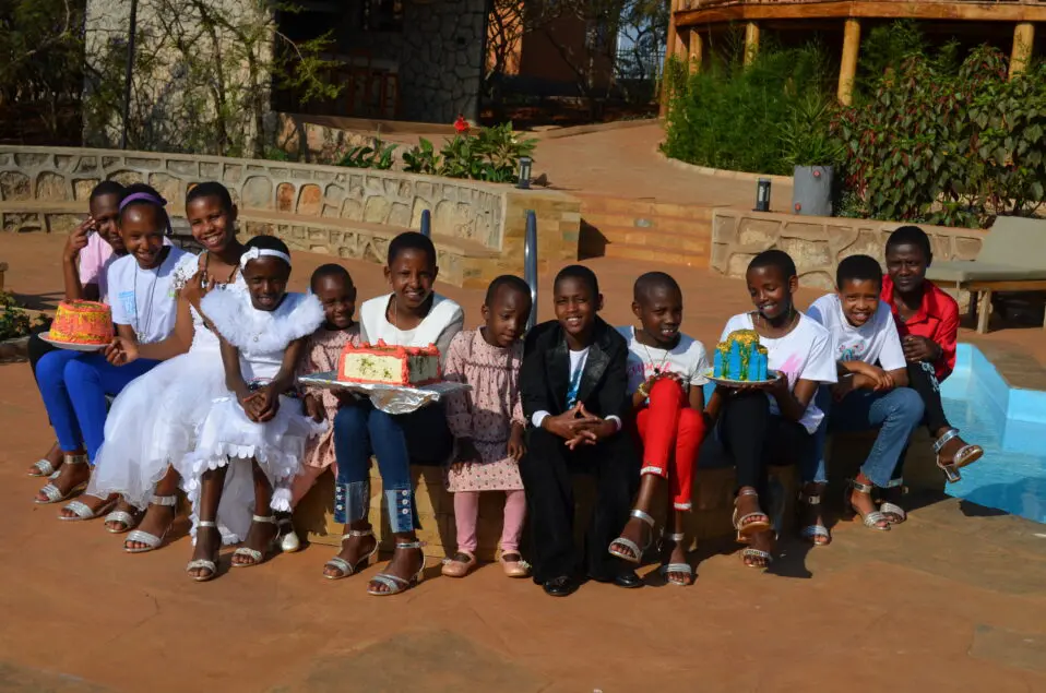 Children celebrating with cakes outdoors