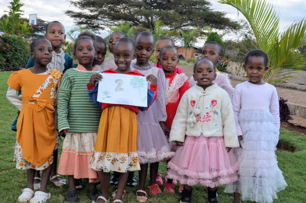 Group of children holding artwork