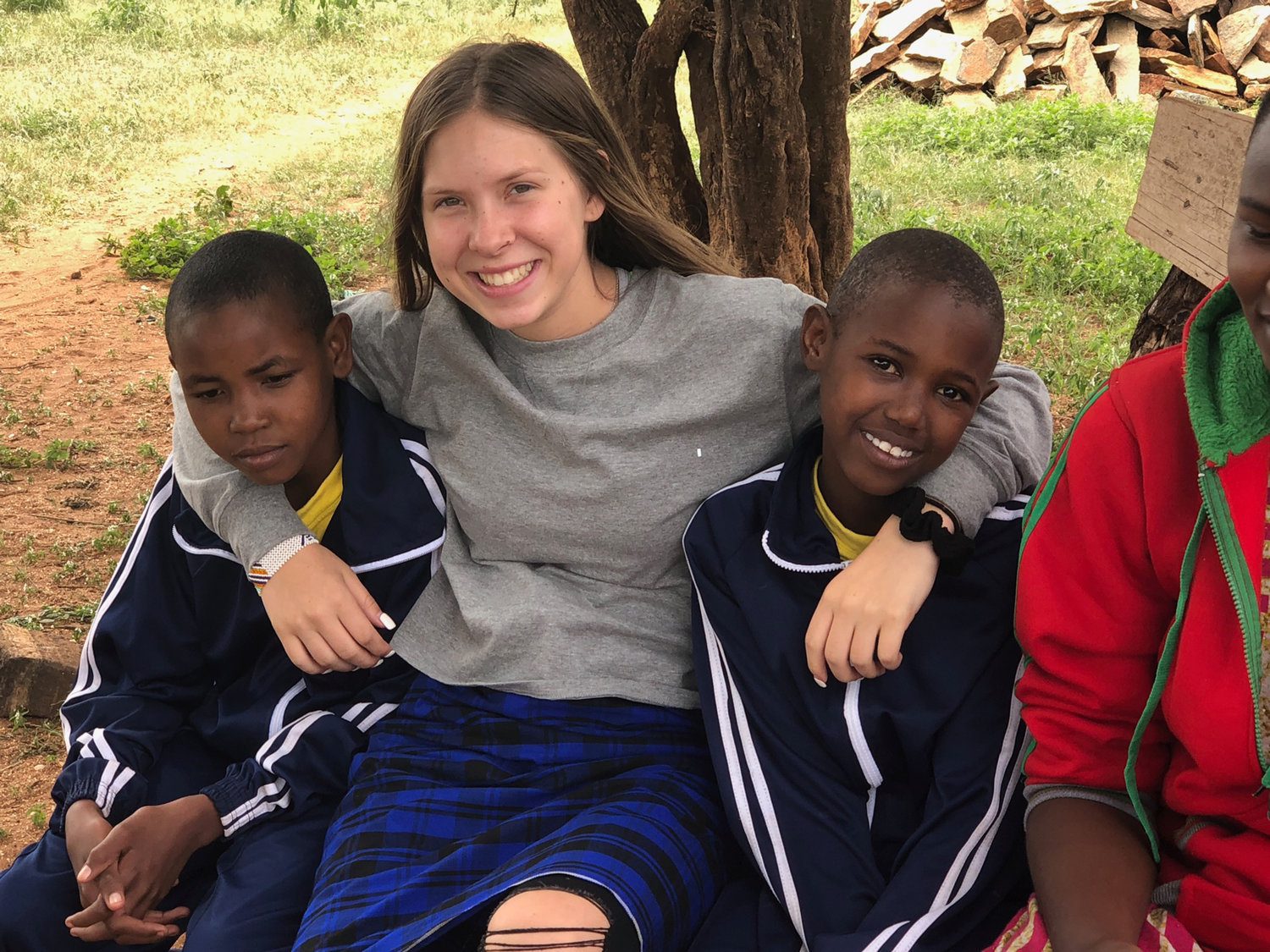 Makayla Henwood with two girls at the Maasai Girls Rescue Center in Tanzania, where she volunteered in 2019 and will serve again this summer.