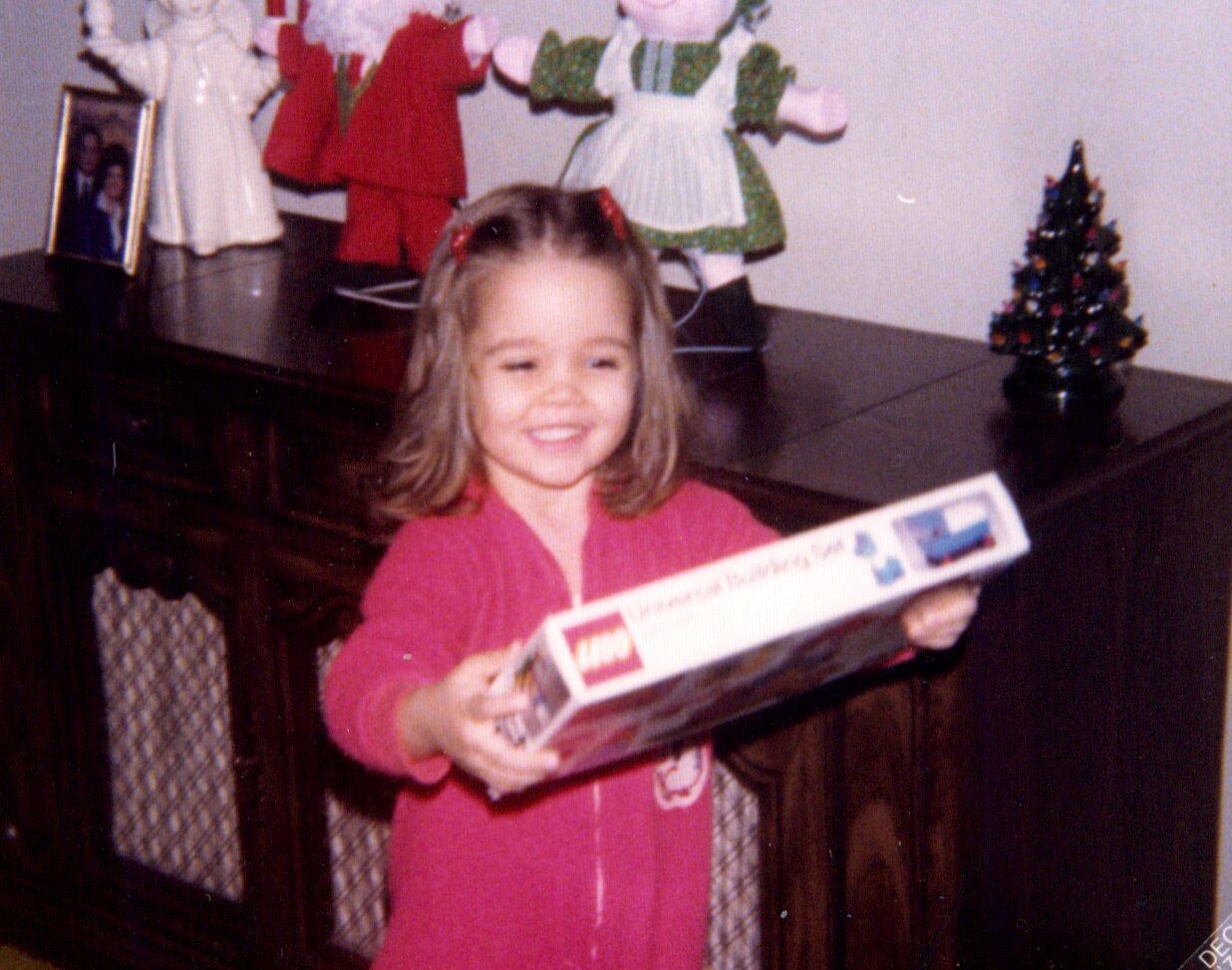 young girl holding a chritmas present