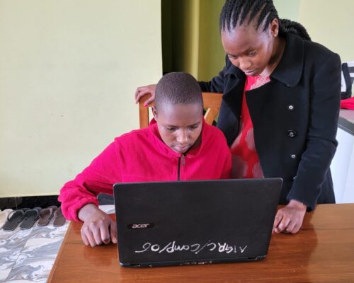 teaching-computer-skills-to-maasai-girl teaching-computer-skills-to-maasai-girl