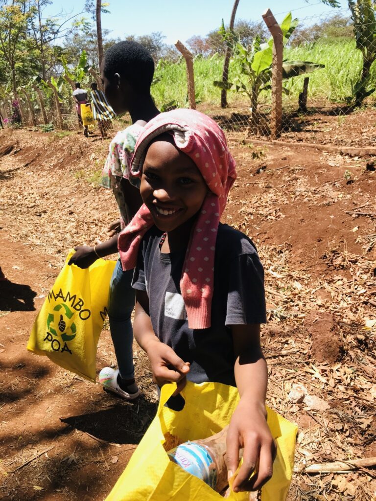 Joyful, smiling girl serving her community 