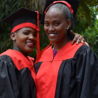 Yeyolai and Nemoipo in graduation caps and gowns