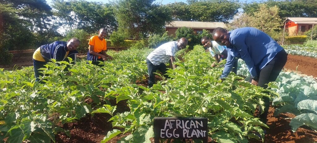yona lumliko teaching maasai girls about ecofarming at MGRC